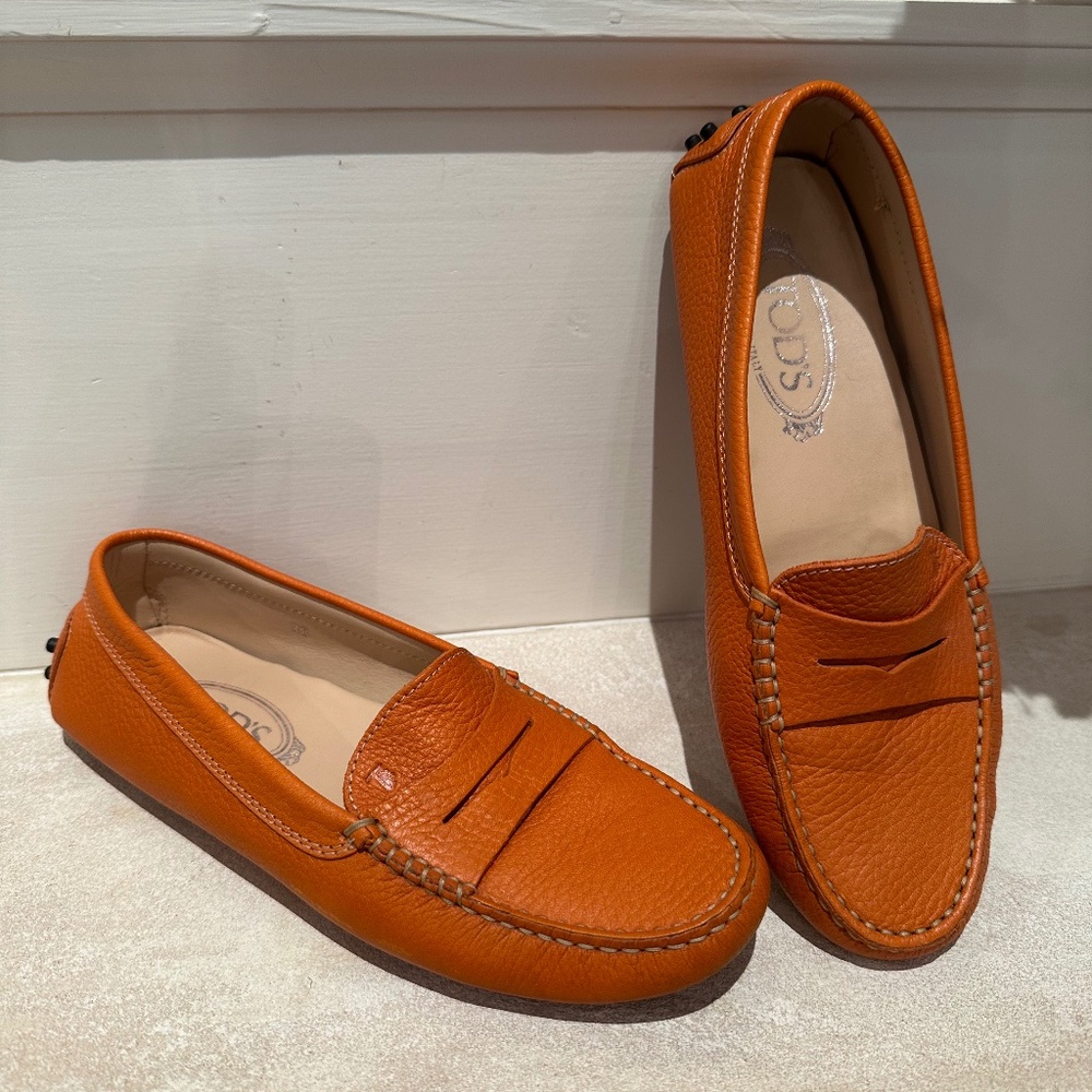 Tods Gommino Driving Shoes in Nubuck  color is Orange Size 38 Excellent cond.